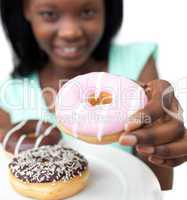 Young woman holding a donut