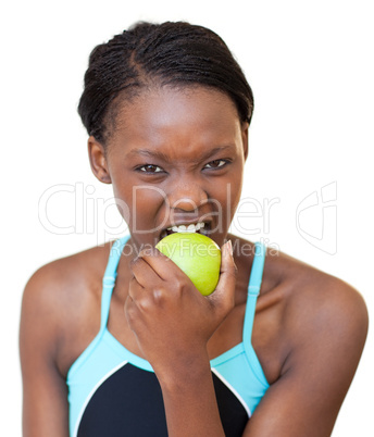 Cheerful fitness woman eating an apple