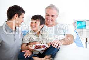 Smiling father and his son visiting grandfather