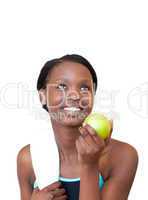 Charming fitness woman eating an apple