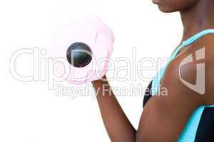 Afro-american woman working out with dumbbell