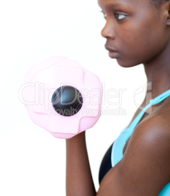 Pretty woman working out with dumbbell