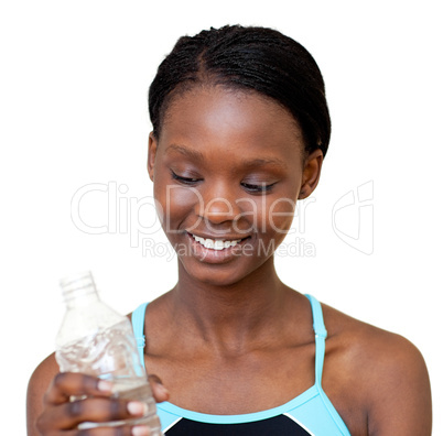 Cheerful woman holding a bottle of water