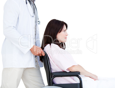 Upset female patient in a wheelchair with her doctor