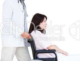 Upset female patient in a wheelchair with her doctor