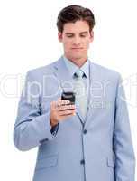 Portrait of a confident businessman sending a text
