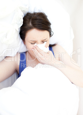 Sick young woman relaxing in her bed