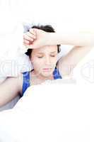 Sick teen girl lying in her bed