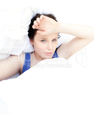 Tired woman relaxing in her bed