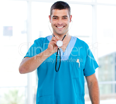 Confident male doctor holding a stethoscope