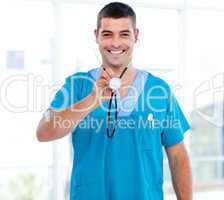 Confident male doctor holding a stethoscope
