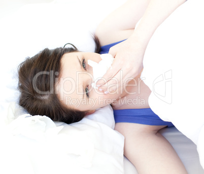 Sick attractive woman relaxing in her bed
