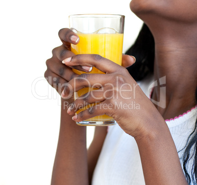 Close-up of a woman drinking orange juice