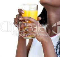 Close-up of a woman drinking orange juice