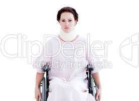 Portrait of a young woman with a neck brace sitting on a wheelch