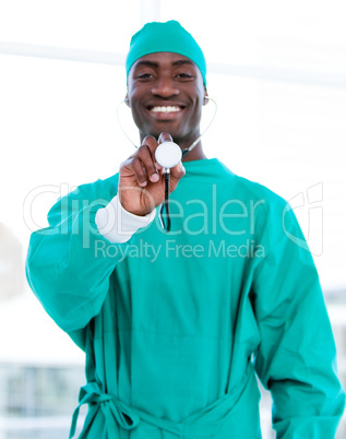 Smiling male doctor holding a stethoscope