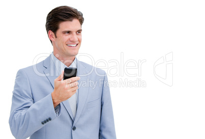 Portrait of a smiling businessman sending a text