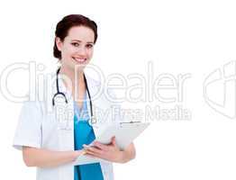 Assertive female doctor making notes in a patient's folder