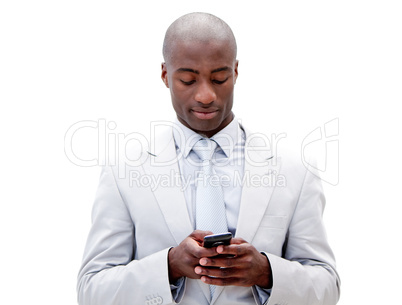 Portrait of a serious businessman sending a text