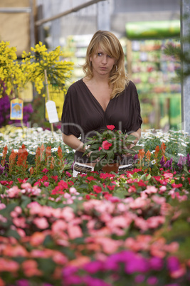 Beautiful blond in gardencenter