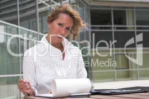 Businesswoman working outdoors