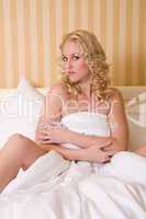 Sensual blond girl in bed