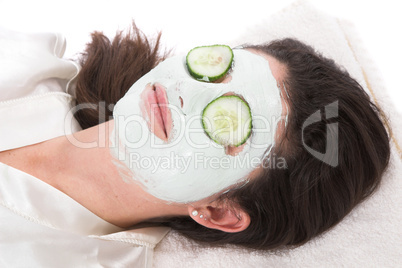 Woman taking a claymask