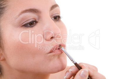 Applying lipstick