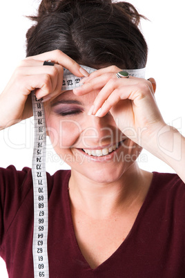 Pretty woman measuring her forehead