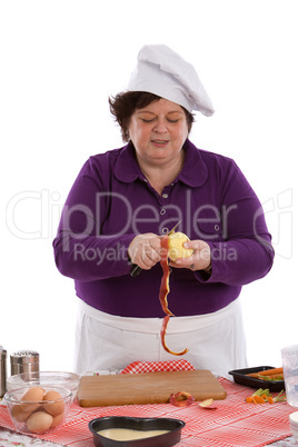 Female chef peeling an apple