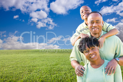 Happy Family Over Grass Field, Clouds and Sky