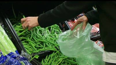 Woman Selecting Green Beans In Produce