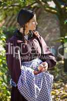 Woman picking the apples