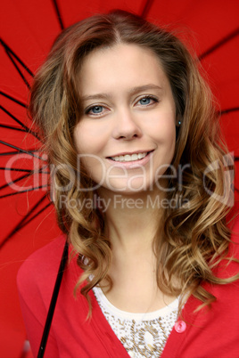 Girl in red under the umbrella