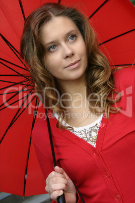 Girl in red under the umbrella