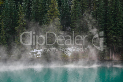 Mist rising from alpine lake