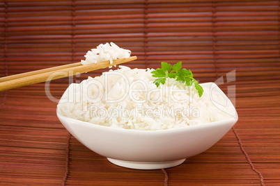 Bowl of rice on mat