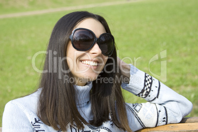 Portrait of beautiful brunette in a park