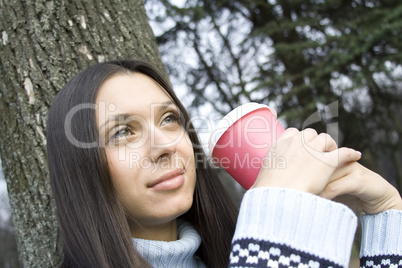 Female in a park сoffee break