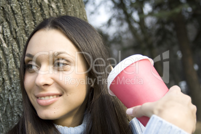 Female in a park coffee break