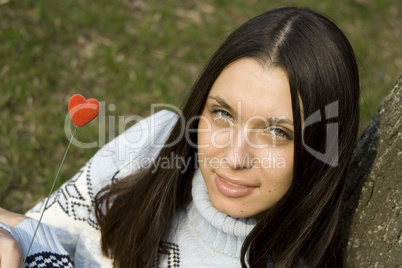 Beautiful girl with a red heart