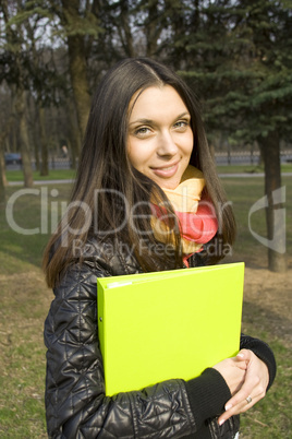 Female in the park with a folder