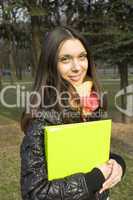 Female in the park with a folder