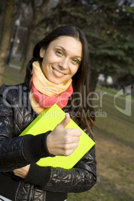 Female in the park with a folder