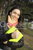 Female in the park with a folder