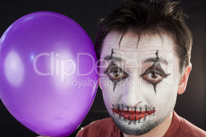 Portrait of a mime with a balloon