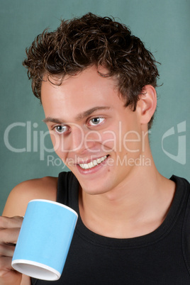 Young man with mug