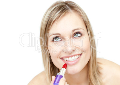 Attractive blond woman putting lipstick