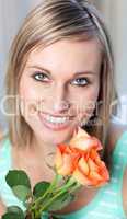 Portrait of a delighted woman holding roses