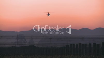 Helicopter with lights at dawn